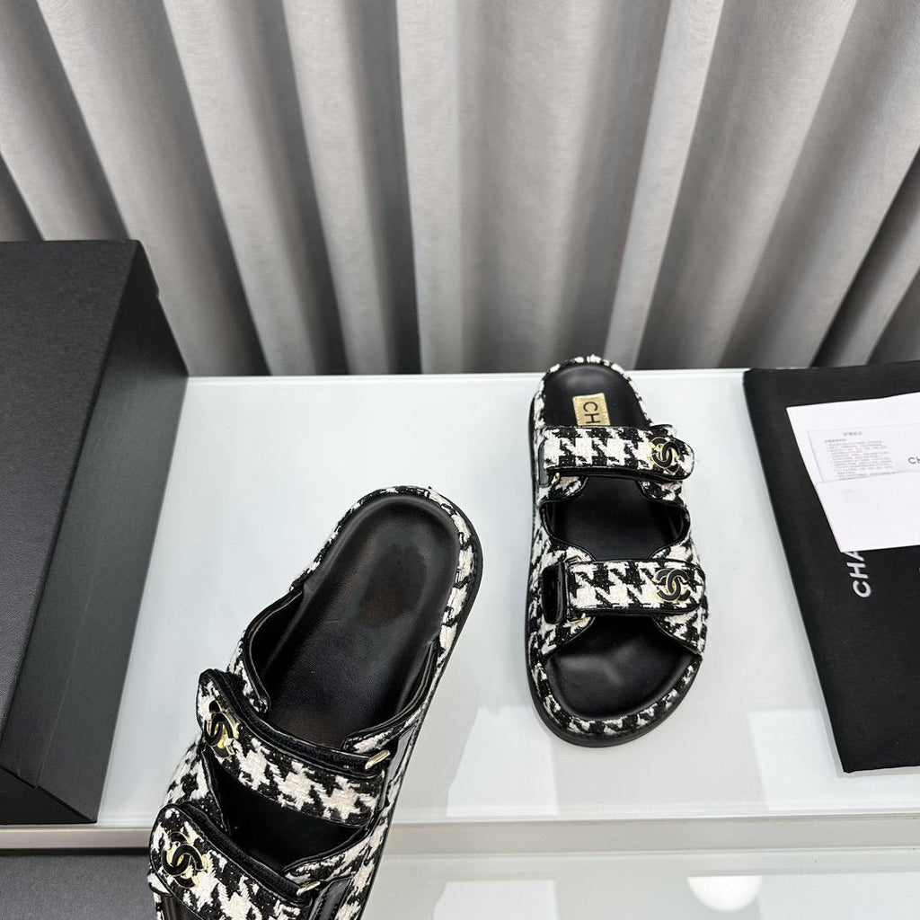 CHANEL dad sandals black white mules